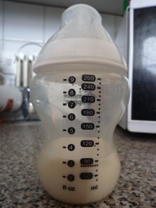 A baby bottle, but should it be filled with formula or breast milk? Formula vs Breastfeeding